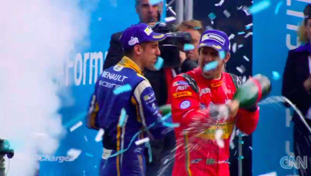 The top two racers celebrating with champagne